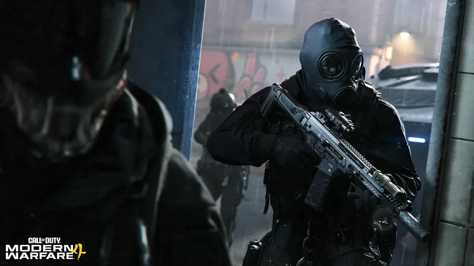 Masked operators advancing through a rain-soaked street
