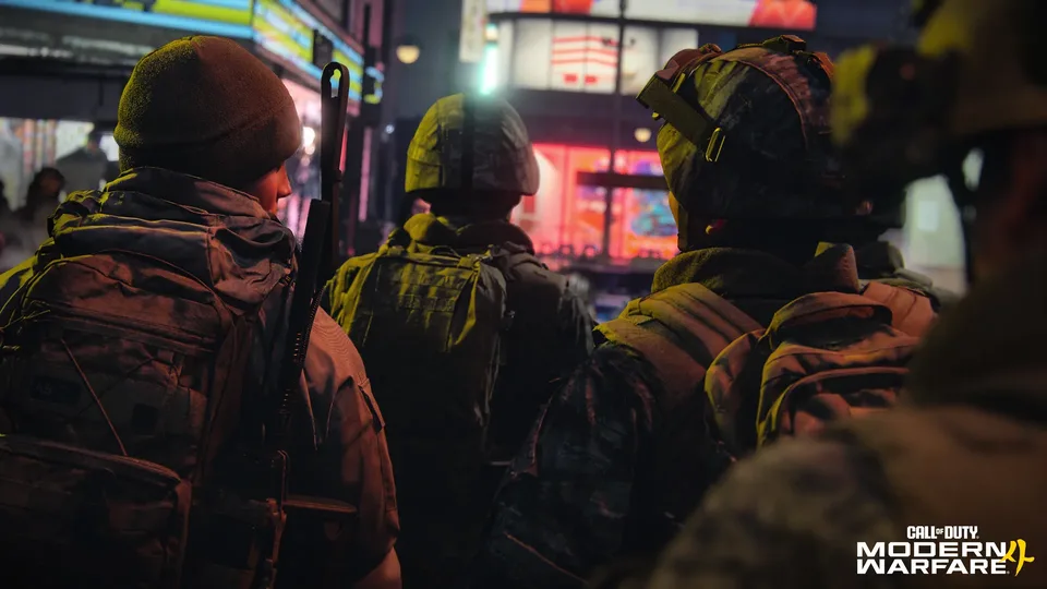 Squad walking through a neon-lit city street at night
